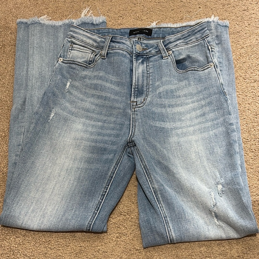Risen size 9/29 Light Blue flare Jeans with frayed hem